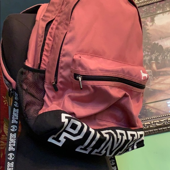Pink back pack with large logo on bottom. - Picture 3 of 8